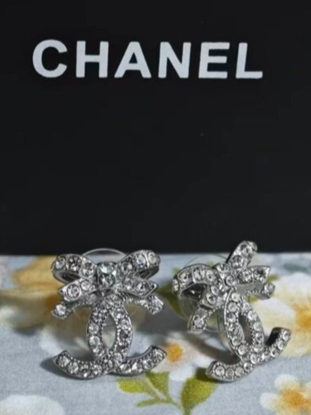 ℒAuthentic CHANEL CC Bow Crystal Stud Earrings, Silver